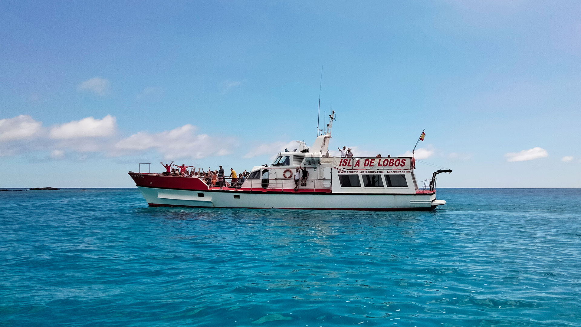 White and red Ferry Isla de Lobos sailing off Corralejo